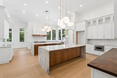 Set on a private peninsula with 600 feet of waterfront, this - photo 11