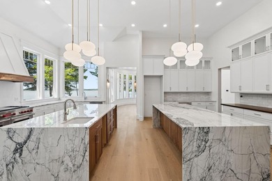 Set on a private peninsula with 600 feet of waterfront, this - photo 12
