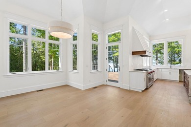 Set on a private peninsula with 600 feet of waterfront, this - photo 14