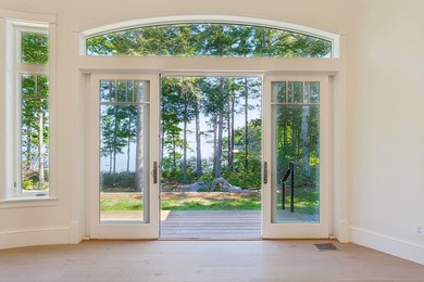 Set on a private peninsula with 600 feet of waterfront, this - photo 20