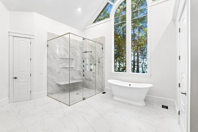 Set on a private peninsula with 600 feet of waterfront, this - photo 21