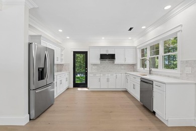 Set on a private peninsula with 600 feet of waterfront, this - photo 40