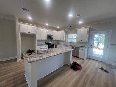 ON THE WATER!!! This beautiful new construction home offers a - photo 11
