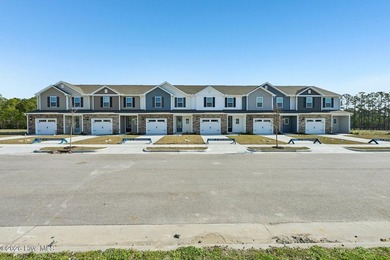 This charming three-bedroom, two-and-a-half-bathroom townhome - photo 2