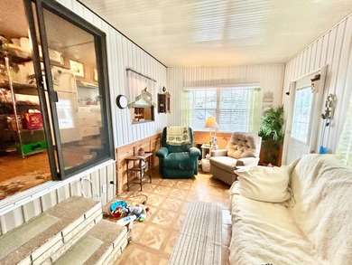 This mobile home is located in a peaceful 55+ community and - photo 3