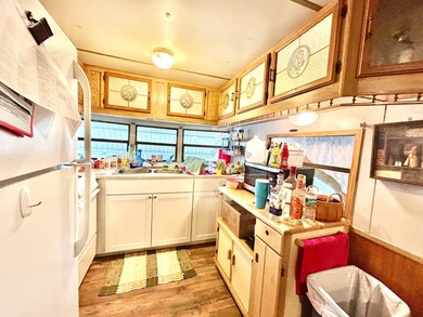 This mobile home is located in a peaceful 55+ community and - photo 4