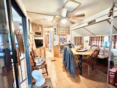 This mobile home is located in a peaceful 55+ community and - photo 5