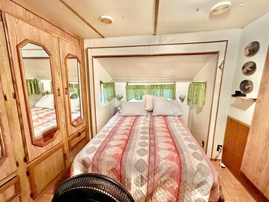 This mobile home is located in a peaceful 55+ community and - photo 6