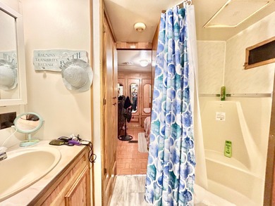 This mobile home is located in a peaceful 55+ community and - photo 7