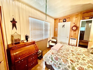 This mobile home is located in a peaceful 55+ community and - photo 9
