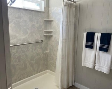 This roomy 1973 manufactured home sits on a quiet cul-de-sac in