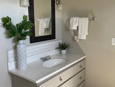 This roomy 1973 manufactured home sits on a quiet cul-de-sac in