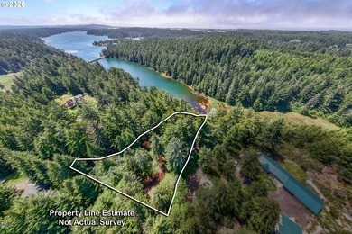 Tucked away in the trees on beautiful Woahink Lake, this rare 1 - photo 1