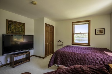 Set on 107 feet of pristine, sandy-bottom frontage along Fourth - photo 44