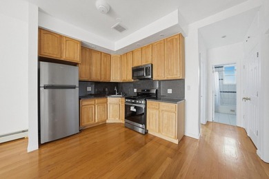 Move right into this lovely renovated two-family townhouse - photo 1