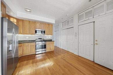 Move right into this lovely renovated two-family townhouse - photo 2