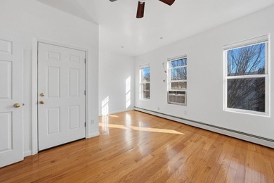 Move right into this lovely renovated two-family townhouse - photo 3