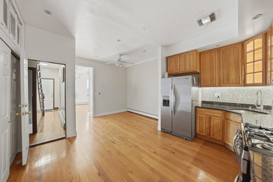 Move right into this lovely renovated two-family townhouse - photo 9