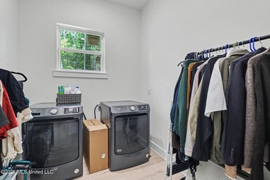 Welcome to this stunning custom-built 2025 home, where modern - photo 23