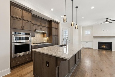 Welcome home to this exceptional John Wieland Craftsman-style