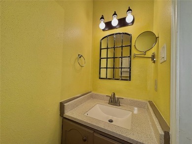 Welcome to this beautifully maintained 2-bedroom, 1.5-bath condo - photo 18