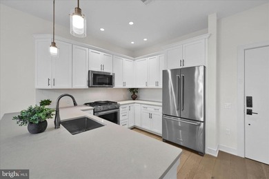 Welcome to Residence #215 at 575 South, where effortless luxury