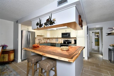 THE UNIT FEATURES NEW TILE FLOORING. IT HAS A SPACIOUS OPEN / - photo 12