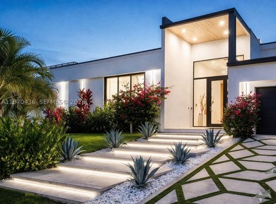 Stunning 4BR/4.5BA waterfront home in gated Bal Harbour. Nearly - photo 3
