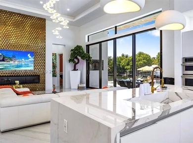 Stunning 4BR/4.5BA waterfront home in gated Bal Harbour. Nearly - photo 9