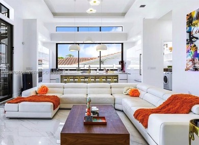 Stunning 4BR/4.5BA waterfront home in gated Bal Harbour. Nearly - photo 10