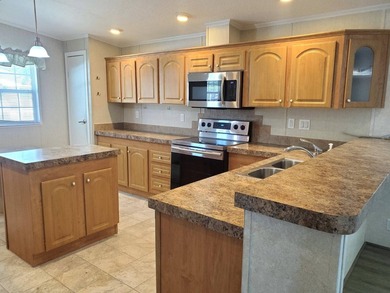 THIS HOME IS ON LEASED LAND WITH A MONTHLY LOT RENT OF $542 AND - photo 1