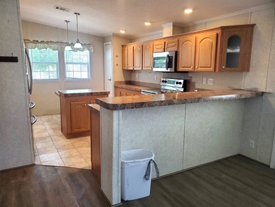 THIS HOME IS ON LEASED LAND WITH A MONTHLY LOT RENT OF $542 AND - photo 5