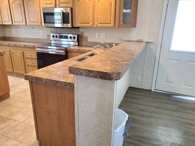 THIS HOME IS ON LEASED LAND WITH A MONTHLY LOT RENT OF $542 AND - photo 6