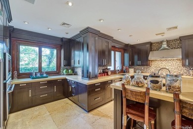 Welcome to this stunning custom-built Mediterranean home, where - photo 9