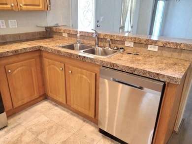 THIS HOME IS ON LEASED LAND WITH A MONTHLY LOT RENT OF $542 AND - photo 10