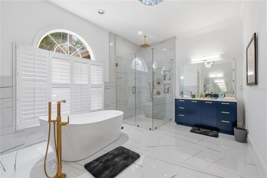 This 7-bedroom, 10-bathroom mini mansion is located in an - photo 21