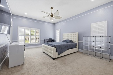 This 7-bedroom, 10-bathroom mini mansion is located in an - photo 27