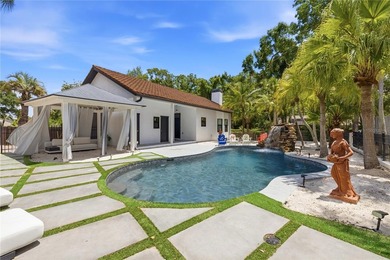 This 7-bedroom, 10-bathroom mini mansion is located in an - photo 33