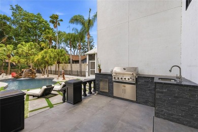 This 7-bedroom, 10-bathroom mini mansion is located in an - photo 37