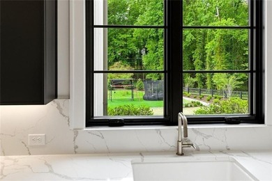 Nestled on 1.34 beautifully landscaped and fully fenced acres in - photo 19