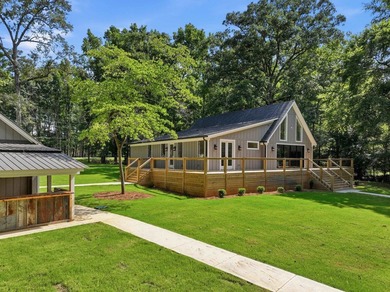 Completely remodeled from top to bottom, this lakefront home is - photo 2