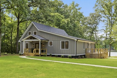 Completely remodeled from top to bottom, this lakefront home is - photo 8