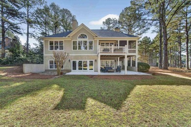 Nestled among the pines in the heart of Cuscowilla, this - photo 3