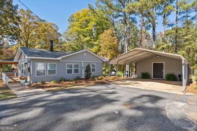 COMPLETELY REMODELED LAKE SINCLAIR HOME ON A FEE SIMPLE LOT, AN - Lake Home For Sale in Eatonton, Georgia