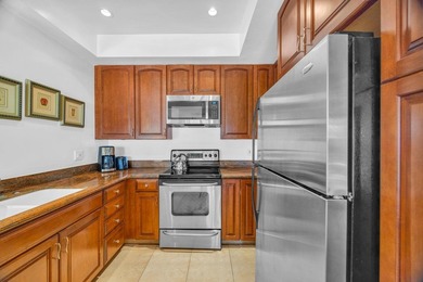 Ocean and fairway views from this beautifully upgraded unit with - photo 12