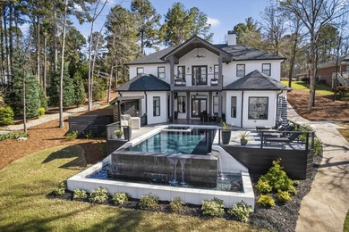 Welcome to this stunning lakefront home in the gated community - photo 2