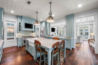 This stunning custom home in WaterColor is a masterful blend of - photo 9