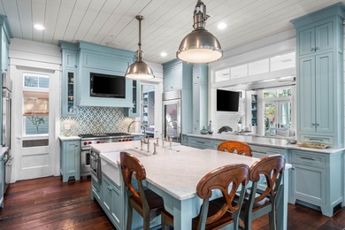 This stunning custom home in WaterColor is a masterful blend of - photo 10
