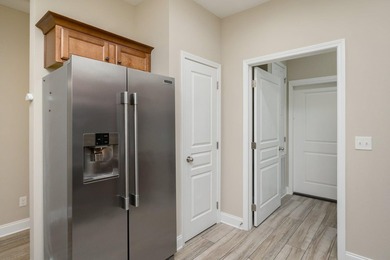 As you step inside, you are greeted with an open floor plan that - photo 11