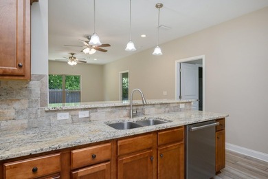 As you step inside, you are greeted with an open floor plan that - photo 12